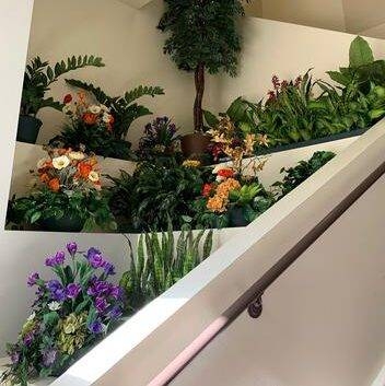 Indoor artificial plantscaping with CA silk flowers